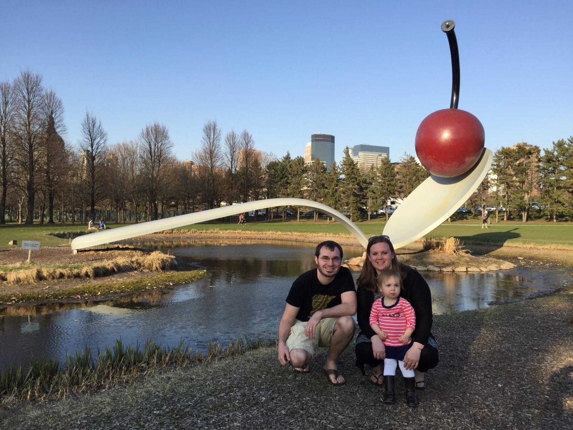 Antonia Grant and her family poses at the Minneapolis Spoon & Cherry sculpture