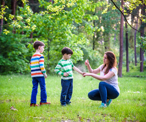 mom applying insect repellant